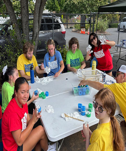 crafting around a table outside