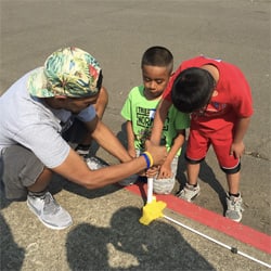 Andrew helping boys