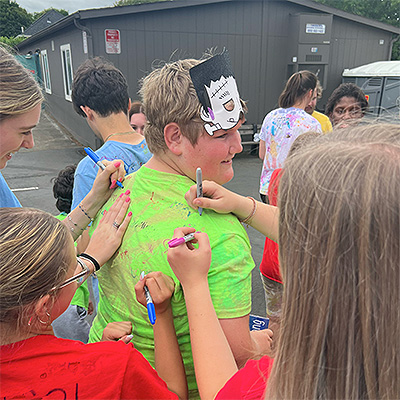 campers signing tshirts